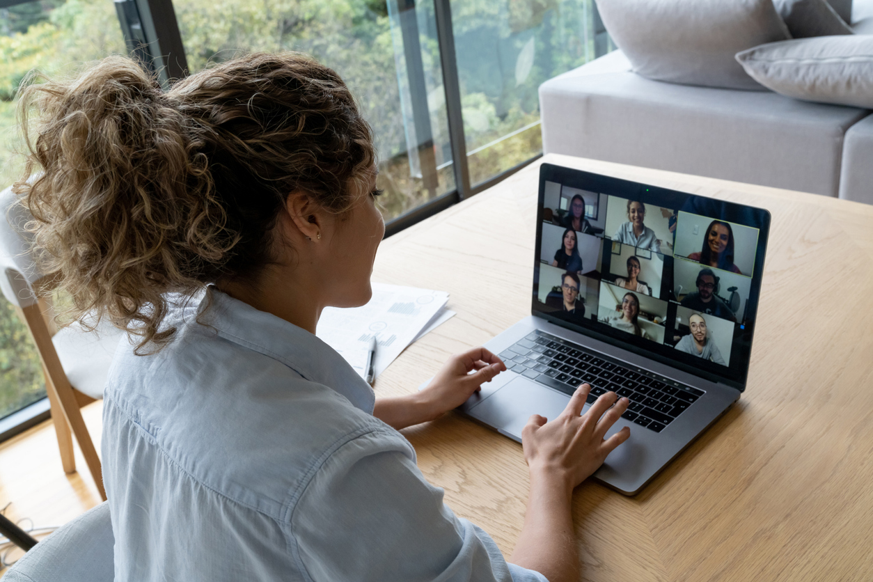 Woman in a video conference with her coworkers while working from home - quarantine lifestyle concepts