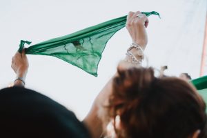 Demonstrators hold up green handkerchiefs, which symbolize the abortion rights movement, during a demonstration in favor of legalizing abortion.